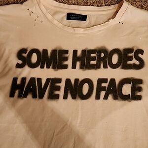 I love this shirt, torn, tattered but too small.  It looks great on!